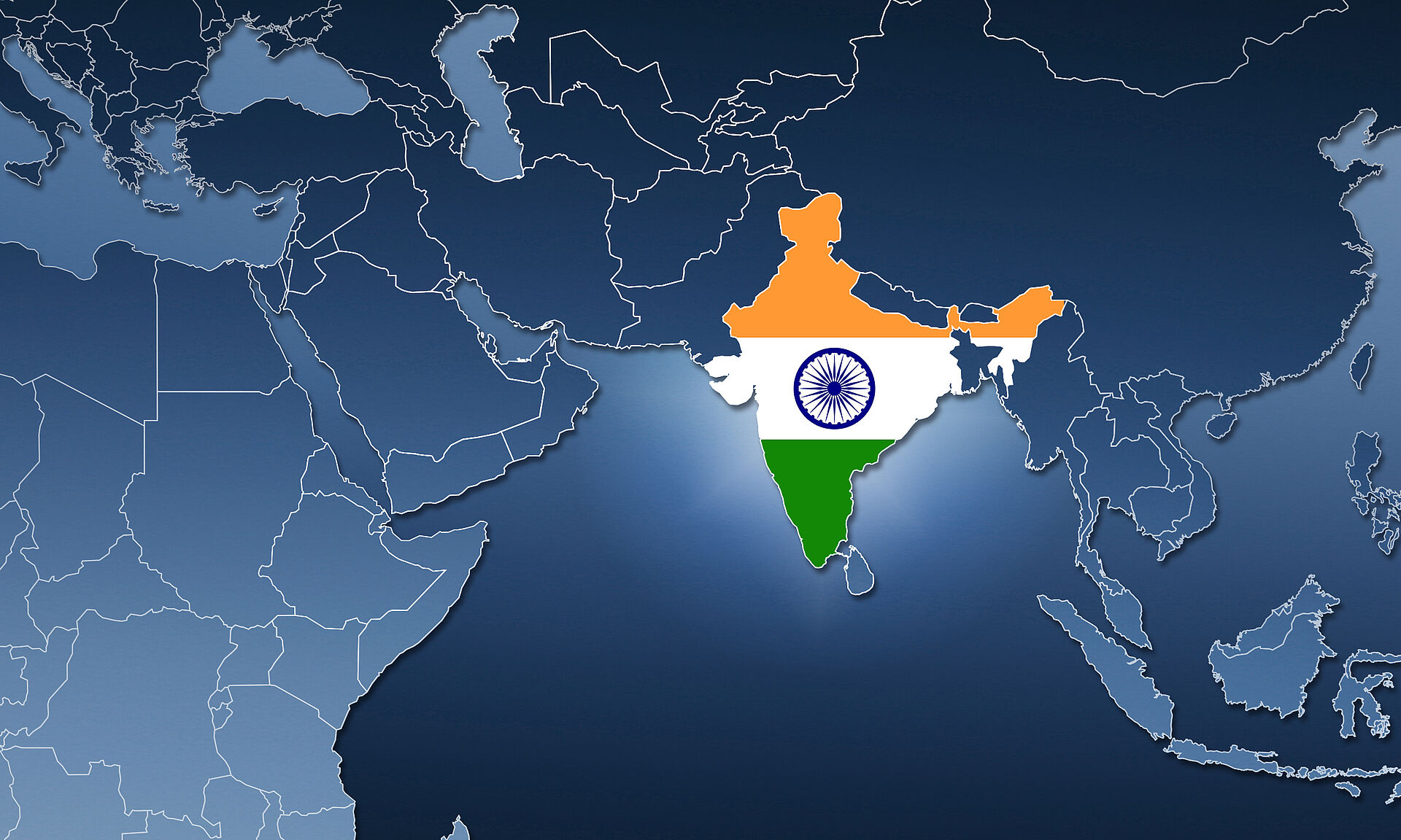 Schematic map in blue tones of Africa and Asia with country borders, in which the area of India is filled in with the Indian flag. The map represents the opening of FAULHABER India Pvt Ltd.