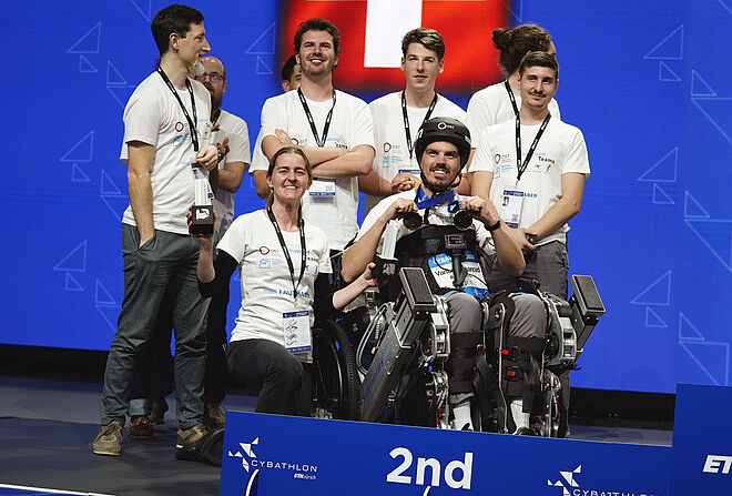 Team photo of the Enhanced Teams of OST Rapperswil at the award ceremony of the Cybathlon 2024 competition.